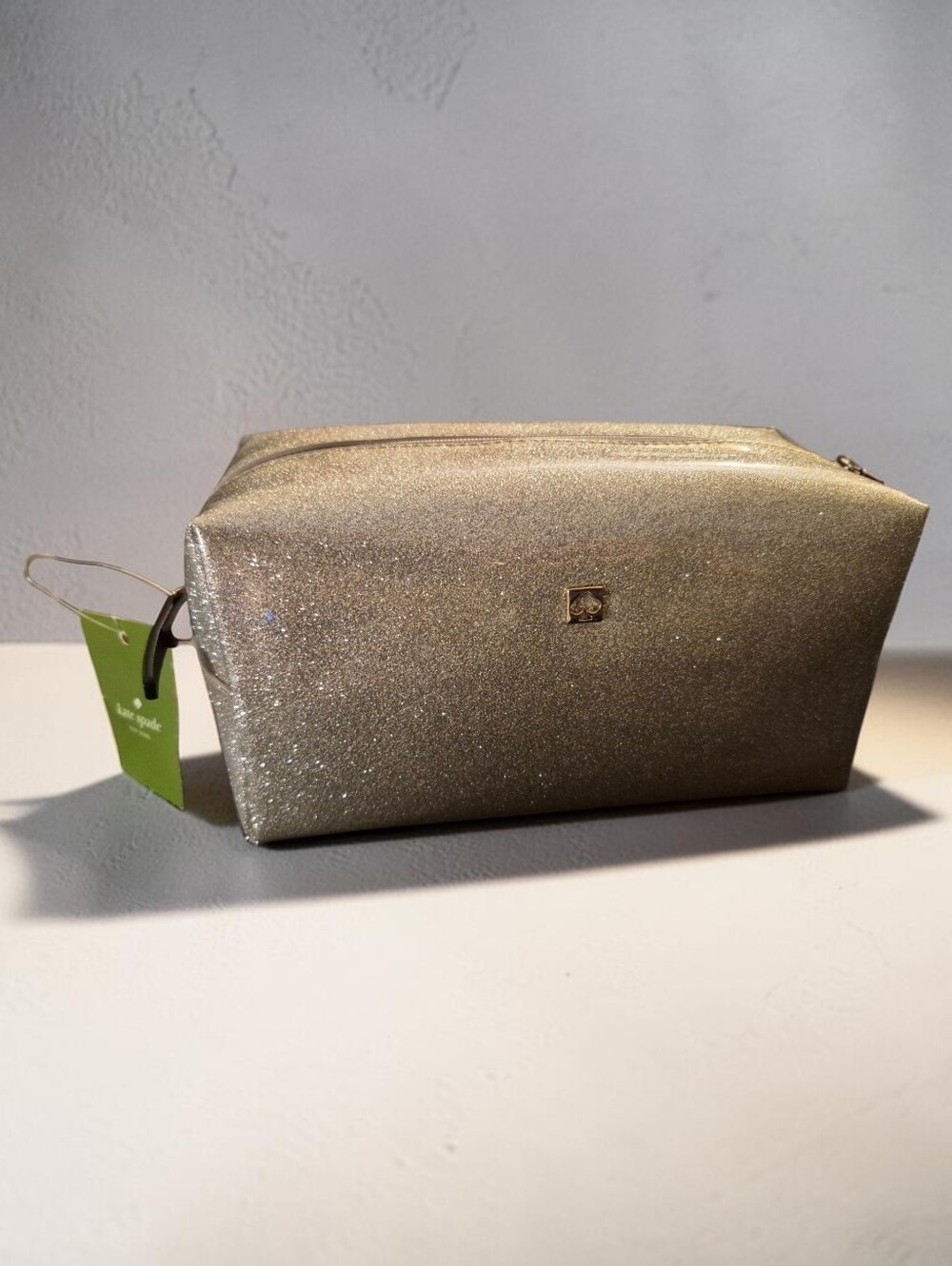 Kate Spade New York Mavis Street "Davie" Cosmetic Case in Silver Glitter.